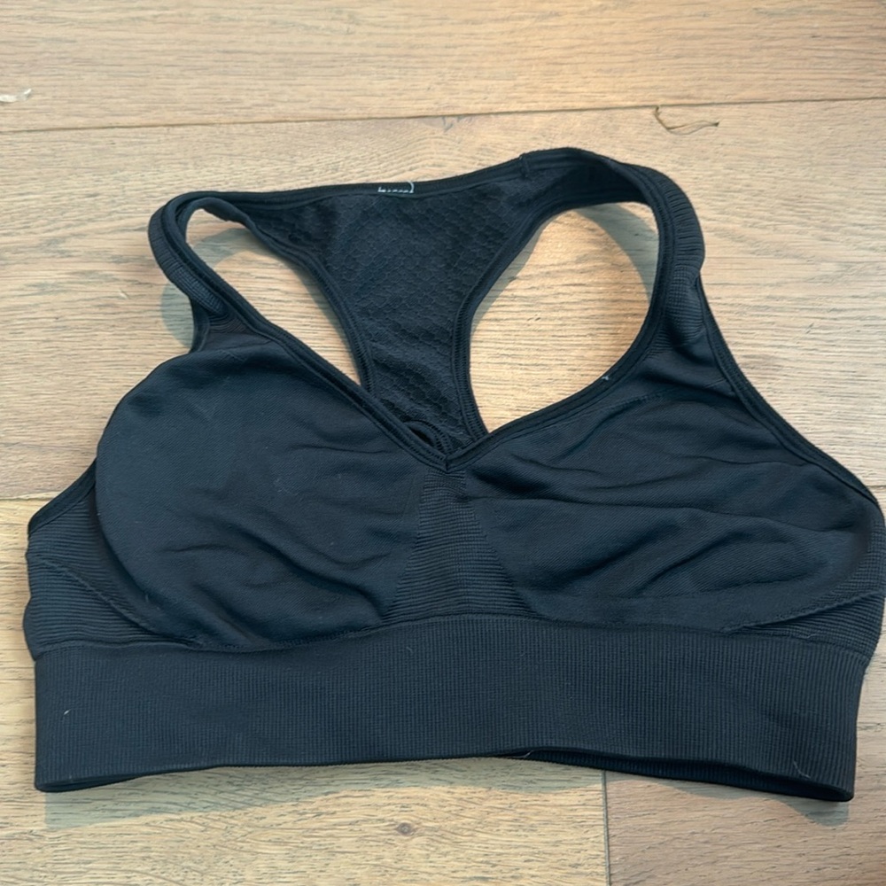 black lululemon sports bra in good condition except for the logo fading